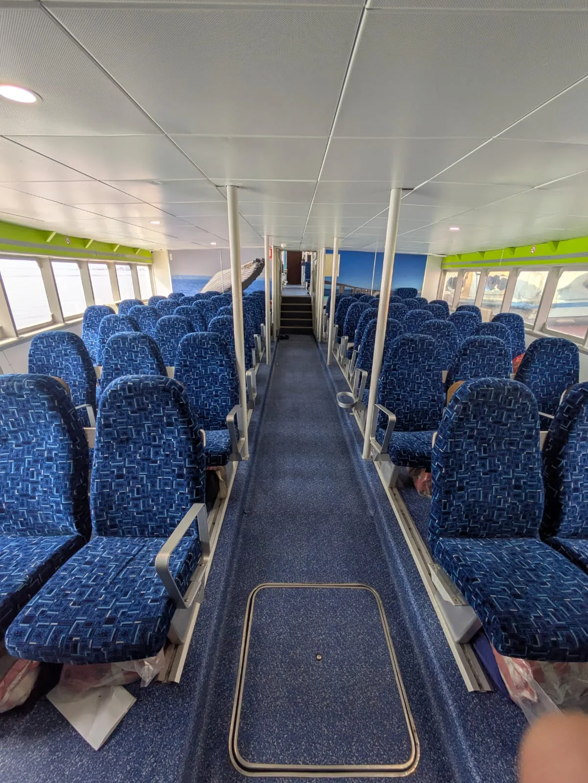 200 passenger ferry for sale — main deck saloon with rows of reclining airline-style seats