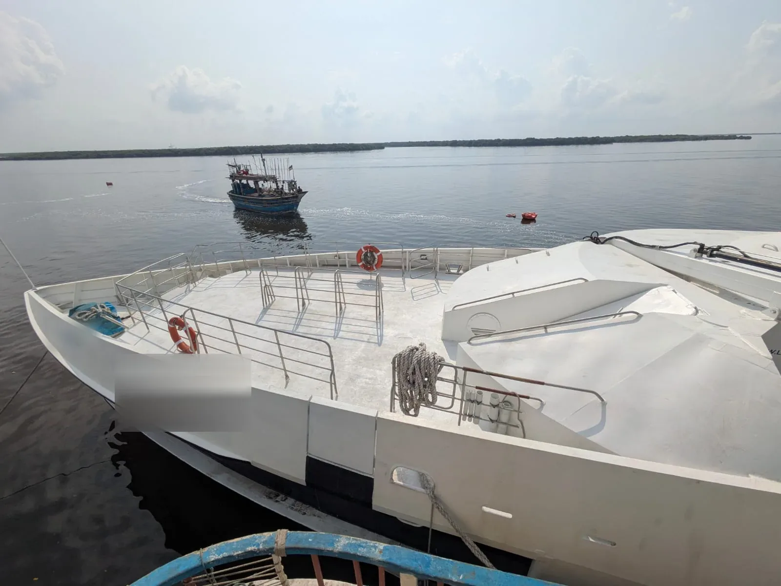 35m high speed passenger ferry for sale — aluminium bow and open foredeck with railings, lying at Karachi