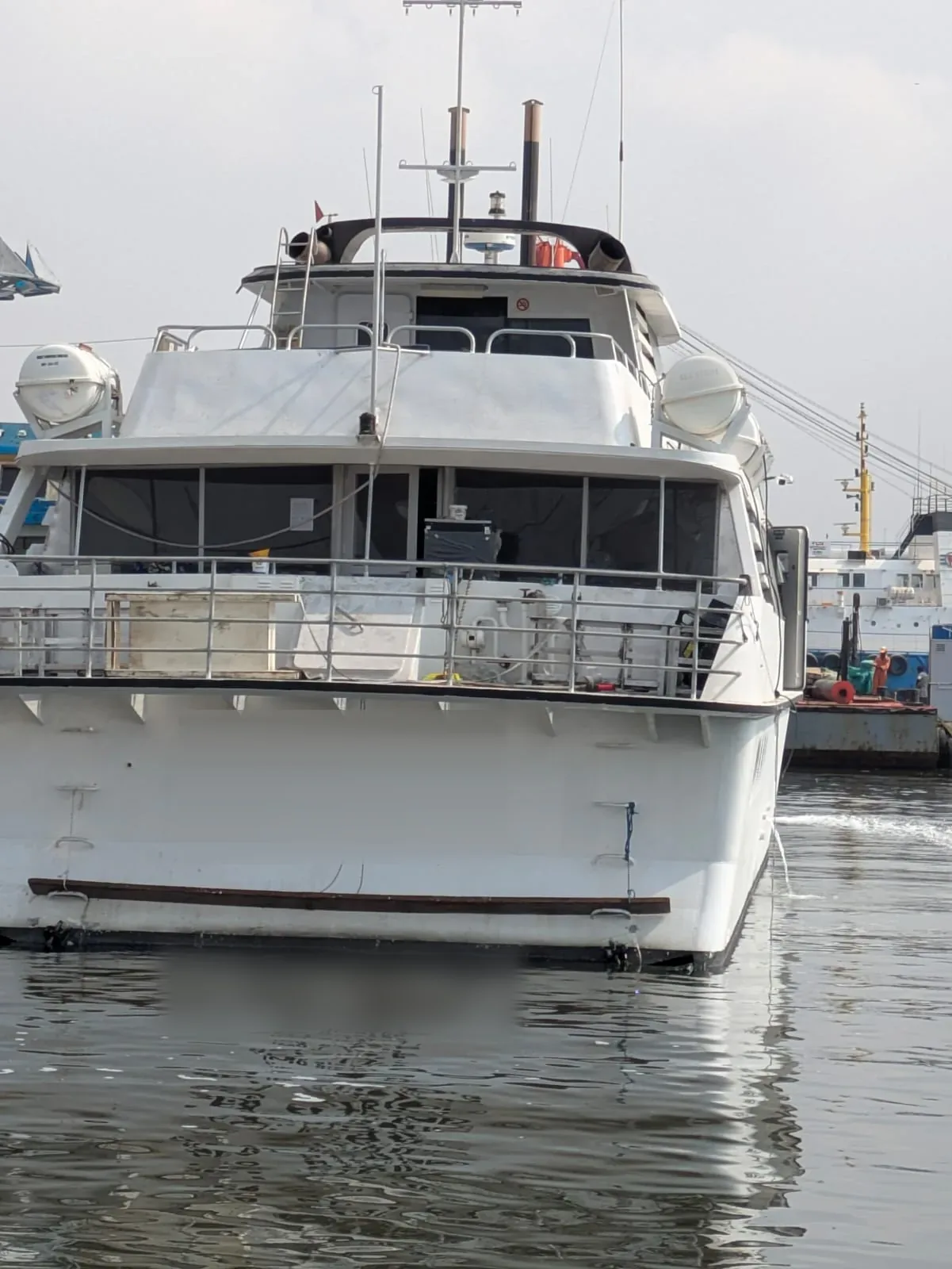 Aluminium monohull fast ferry for sale — stern view showing aft deck, upper deck and life raft stowage