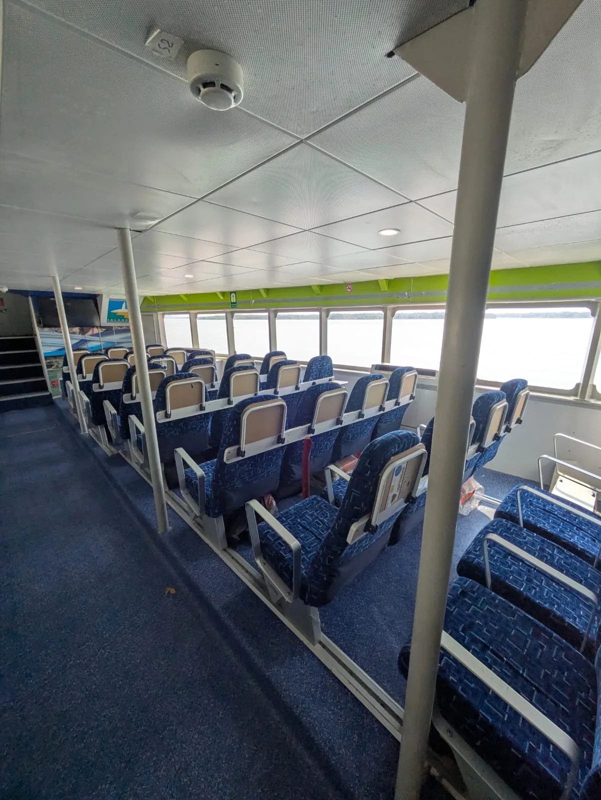 Fast ferry for sale — upper deck passenger saloon with seating and panoramic windows